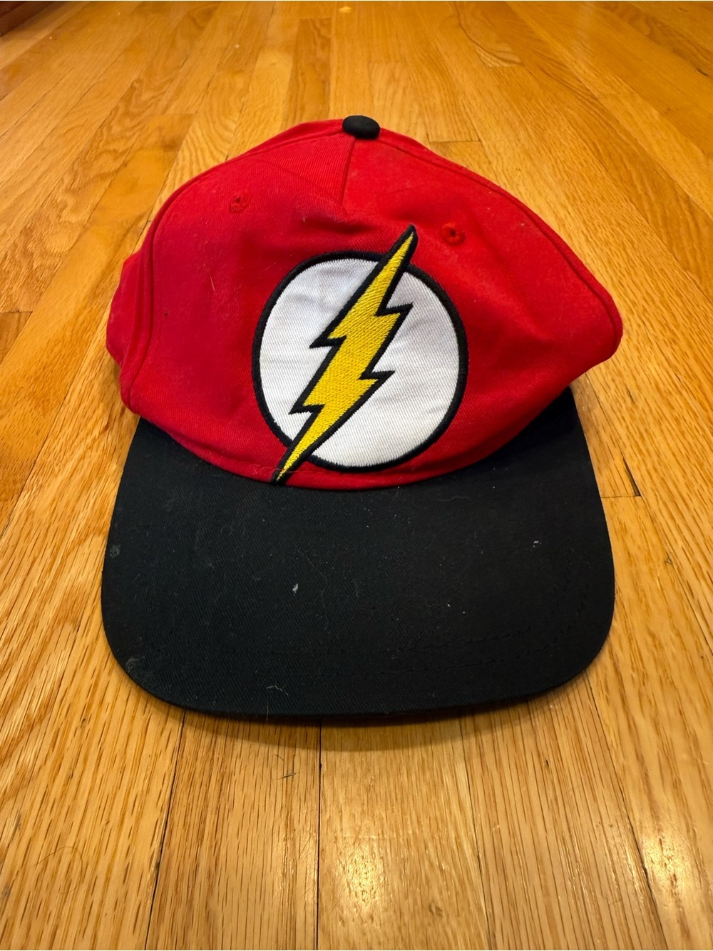 The Flash Red and Black Snapback Hat with Yellow Lightning Emblem